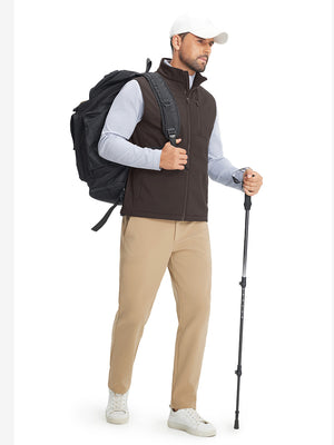 Full-body shot of model while wearing sleeveless softshell fleece outdoor vests with 6 pockets in coffee brown