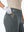 Detail view of front pocket on dark gray women's regular fit stretchy golf pants