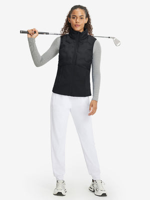 Model holding golf club full body, women's lightweight slim-fit puffer vest styled in sporty black