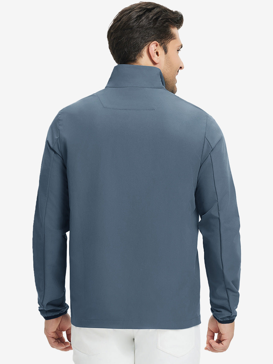 Back upper body view of the misty blue mock neck golf pullover, model turns head for relaxed pose.