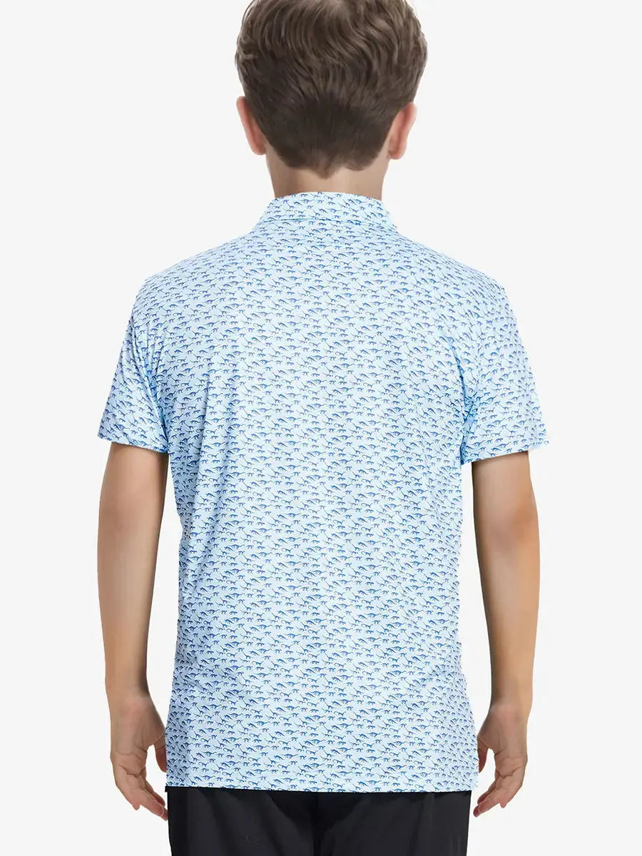 Back half-body view of boy wearing BLUE DINOSAUR Performance Print Boys Golf Polo outdoors