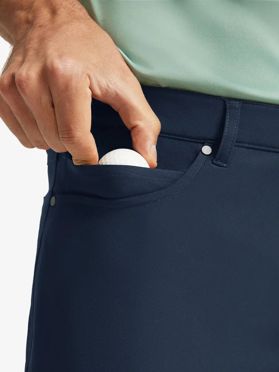 NAVY 4-way Stretch Performance Solid Shorts, front pocket holding golf ball detail, 9 Inch