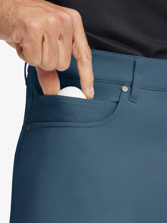 GRAYISH BLUE 4-way Stretch Performance Solid Shorts, front pocket holding golf ball detail, 9 Inch