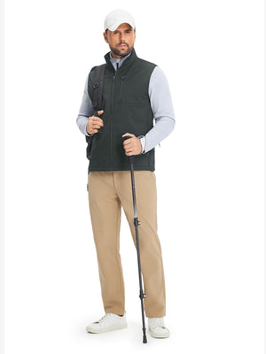 Full-body shot of model while wearing sleeveless softshell fleece outdoor vests with 6 pockets in grey