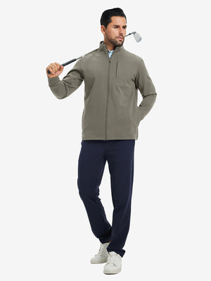 Model holding a golf club, wearing dark khaki water-resistant zip up golf jacket in full-body view.
