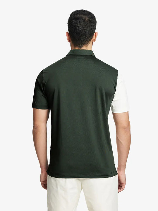 Back half-body view of model in OLIVE GREEN Moisture Wicking Color Block Polo Shirt.