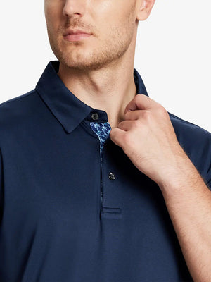 Male model wearing the Navy Everyday Classic Solid Polo, front view from nose to chest