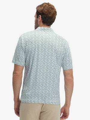 Back half-body view of model wearing the green forest 4 way stretch print collared polo shirt, highlighting the rear silhouette