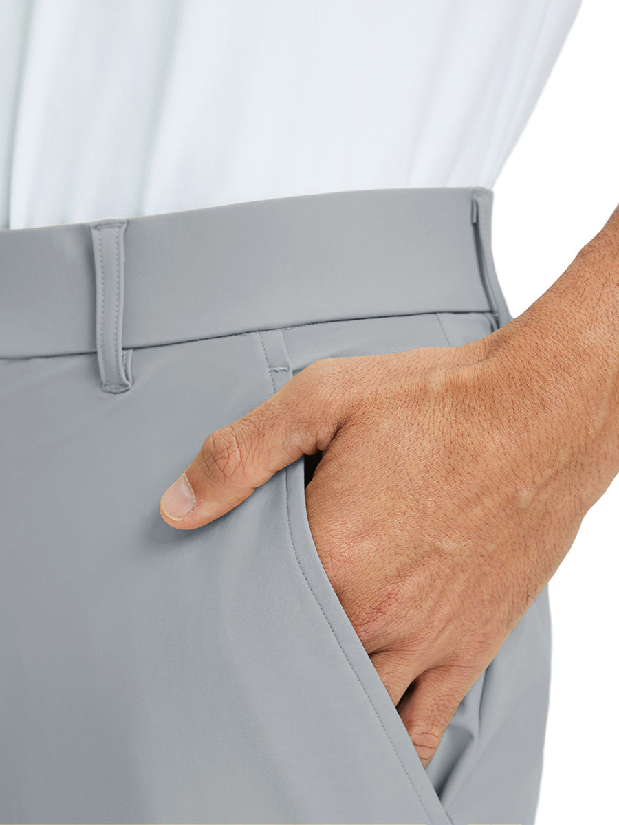 Close-up detail of one hand resting in pocket, showing relaxed fit of the light grey quick dry pants.