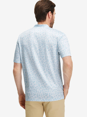 Back half-body of model in white blue florals stretch printed collarless henley golf shirts