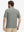Back half-body view of a model wearing the black feather weight jacquard polo shirts, highlighting the rear fit