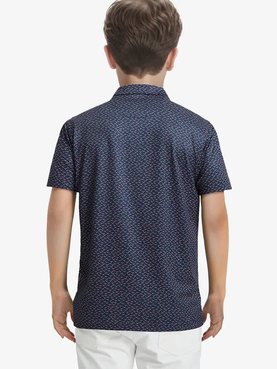 Back half-body view of boy wearing NAVY PINK SEAGULL Performance Print Boys Golf Polo outdoors