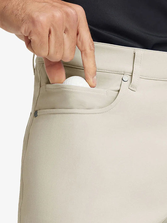 LIGHT KHAKI 4-way Stretch Performance Solid Shorts, front pocket holding golf ball detail, 9 Inch