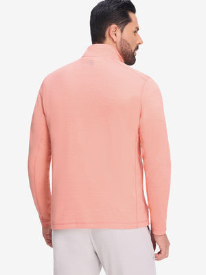 Back upper body shot of model wearing orange red grid featherweight midlayer quarter zip pullover