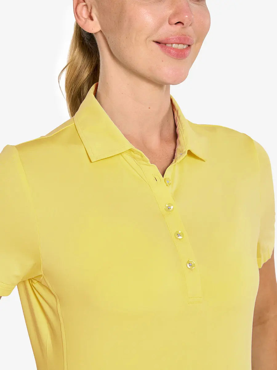 Close-up front view from nose to chest in YELLOW Women's Performance Solid Polo