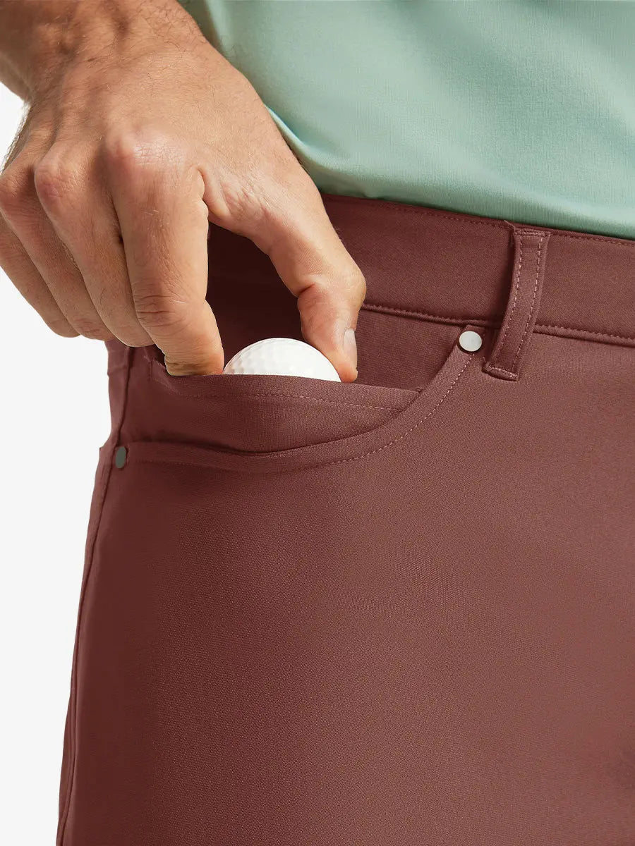 CRANBERRY 4-way Stretch Performance Solid Shorts, front pocket holding golf ball detail, 9 Inch