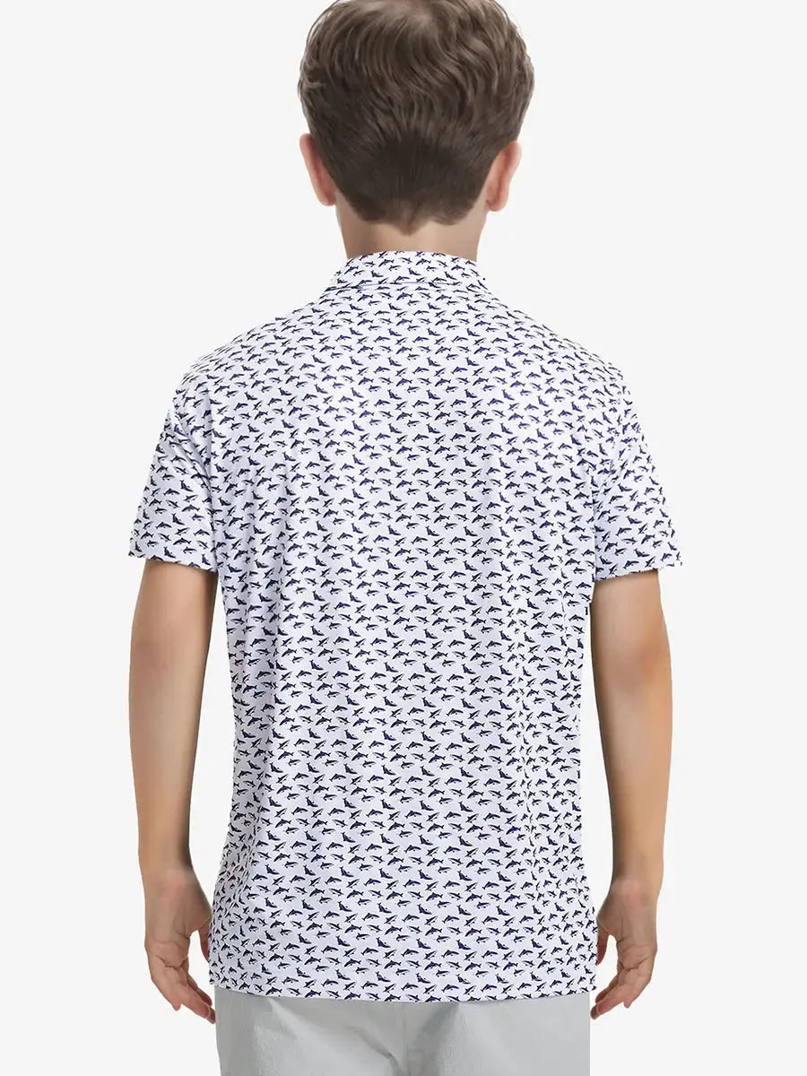 Back half-body view of boy wearing WHITE PURPLE SHARK Performance Print Boys Golf Polo outdoors