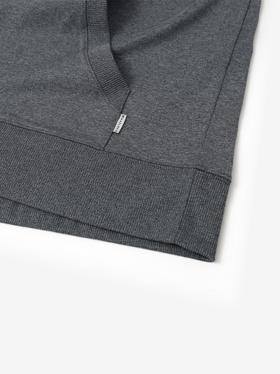 Hem detail of the Black Grey Heather Athletic Golf Hoodie, highlighting clean stitching and neat design.