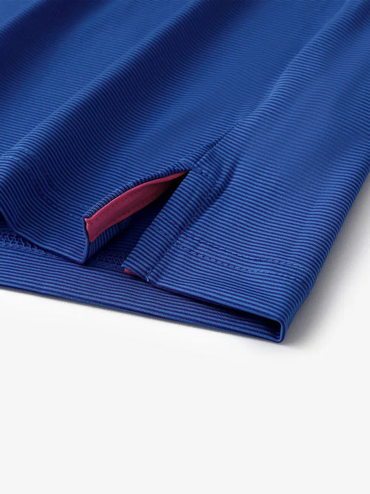Hem slit detail of COBALT STRIPE Pinstripe Jersey Performance Polo								
