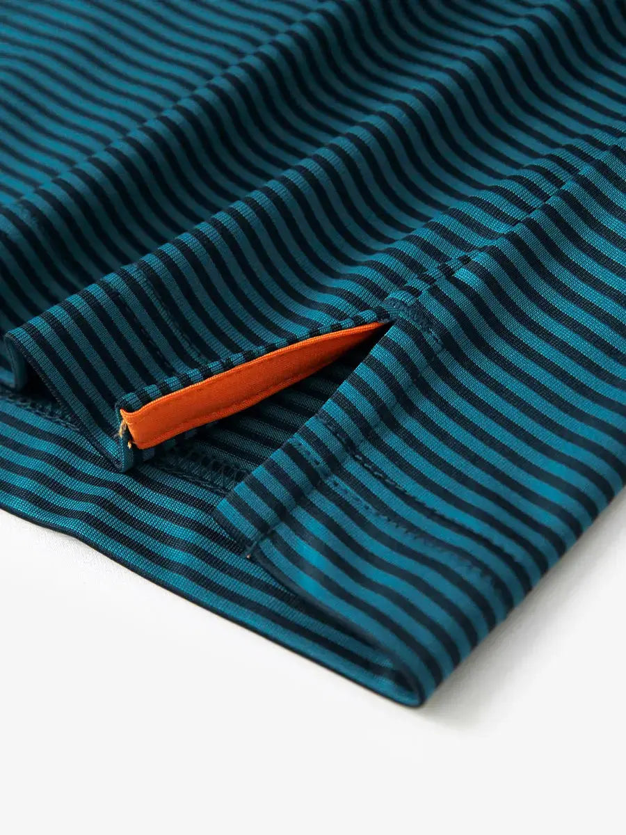 Detailed view of side hem slit on Cooling Stripe Golf Shirt in TURQUOISE STRIPE, showing comfort and design