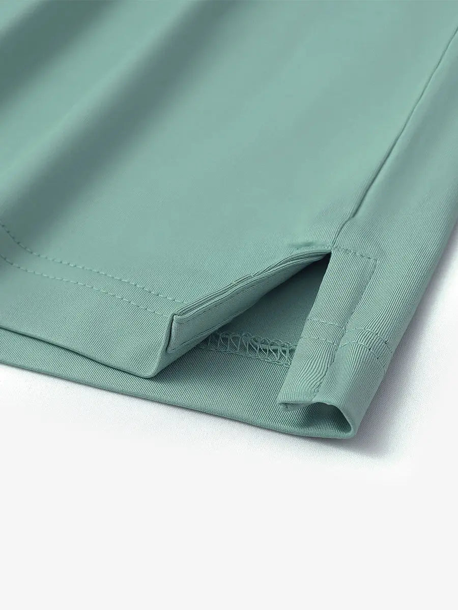 Close-up of hem slit detail on Everyday Solid Jersey Polo in BERYL GREEN, showing fine craftsmanship.