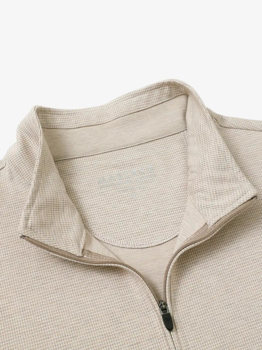 Close-up of collar and interior logo detail on KHAKI HOUNDSTOOTH Premium Jacquard Quarter Zip Pullover.								
