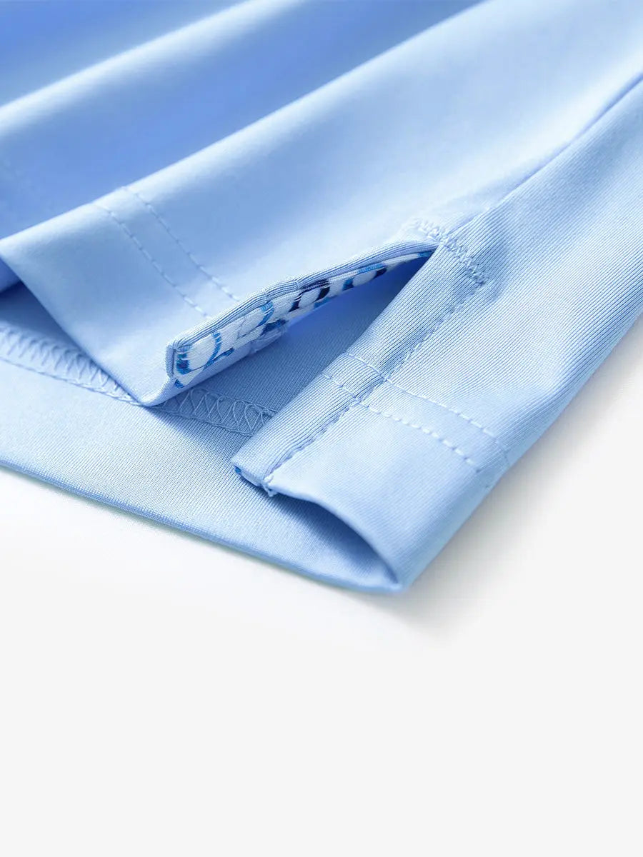 Close-up of side slit hem detail on LIGHT BLUE Long Sleeve Solid Jersey Polo