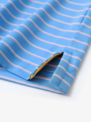 Close-up of hem slit on SKY BLUE/PINK STRIPE Polo — neat and breathable finish