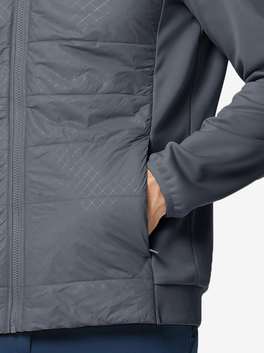 Hand in single pocket detail of the dark grey Golf Fleece Winter Jacket, soft thermal material.