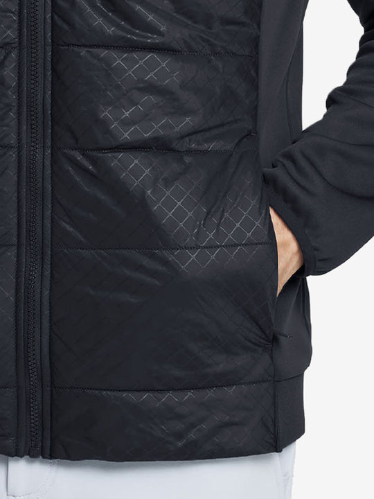 Hand in single pocket detail of the black Golf Fleece Winter Jacket, soft thermal material.