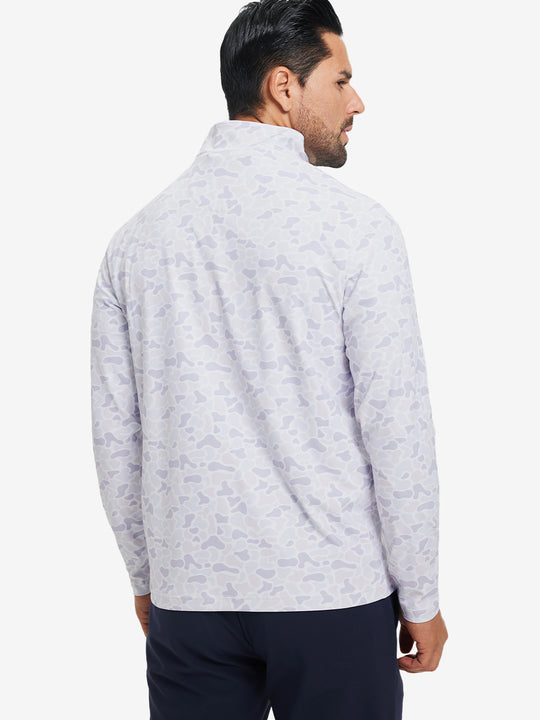 Back upper body angle of the brown grey camo full print quarter zip pullover, model turns head slightly.