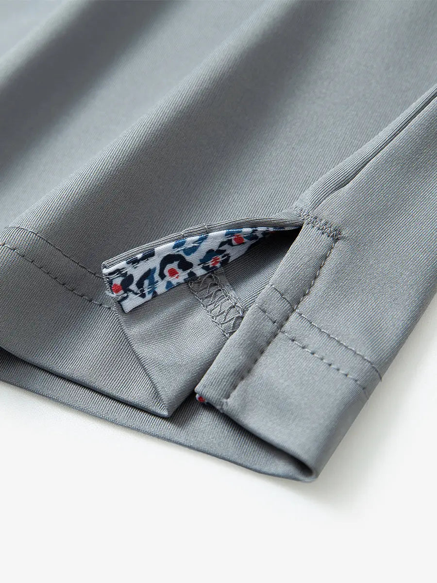 Close-up of side slit hem detail on LIGHT GREY Long Sleeve Solid Jersey Polo