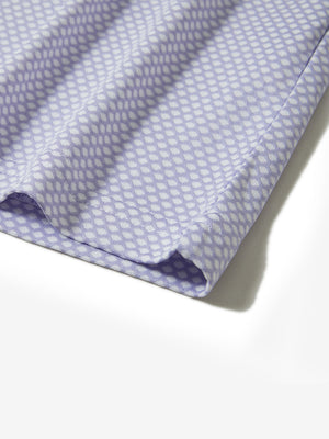 Hem detail of jacquard quarter zip pullover in lavender, focusing on stitching and side vent finish.