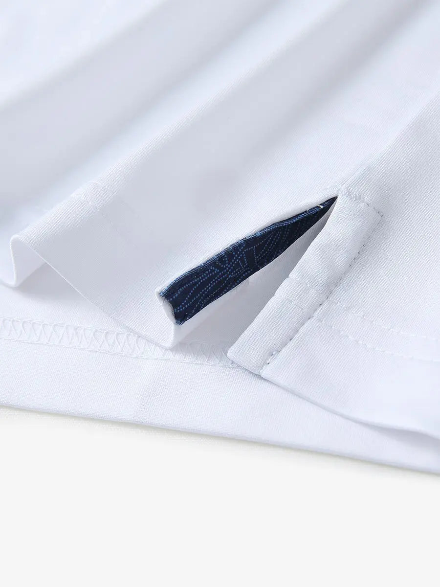 Close-up of side slit hem detail on WHITE Long Sleeve Solid Jersey Polo