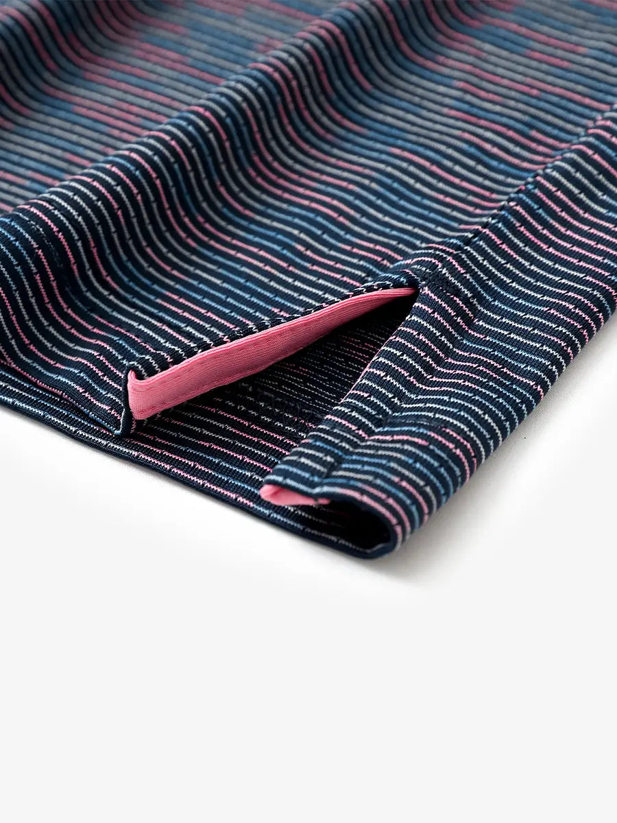 Hem slit detail of SPACE DYE STRIPE Performance Yarn Dye Striped Polo highlighting stitching and finish