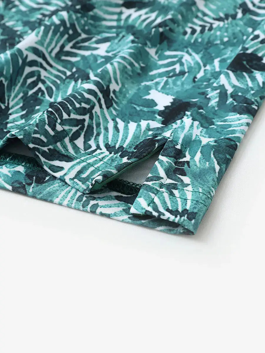 Detailed shot of side hem slit on DARK GREEN LEAF polo for all-day comfort and stretch