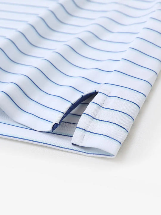 Close-up of side hem slit on WHITE/LIGHT BLUE STRIPE Polo with subtle stripe texture