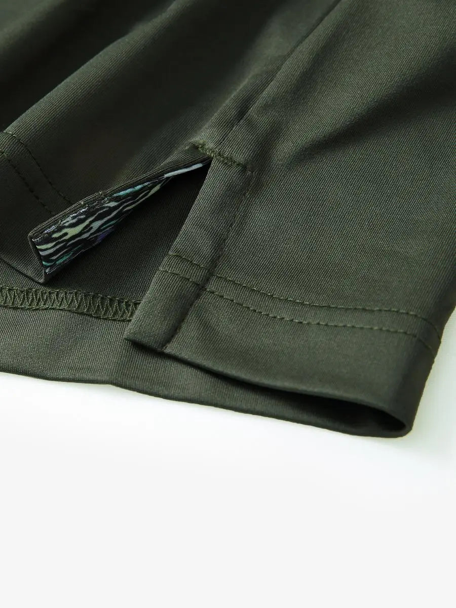 Close-up of side slit detail on the Olive Green Everyday Classic Solid Polo hem