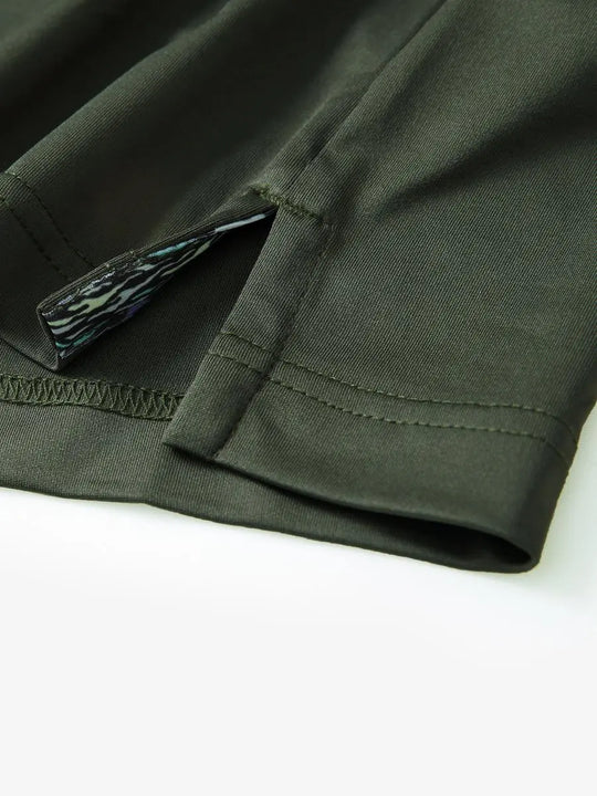Close-up of side slit detail on the Olive Green Everyday Classic Solid Polo hem