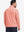 Back upper body angle of the red line full print quarter zip pullover, model turns head slightly.