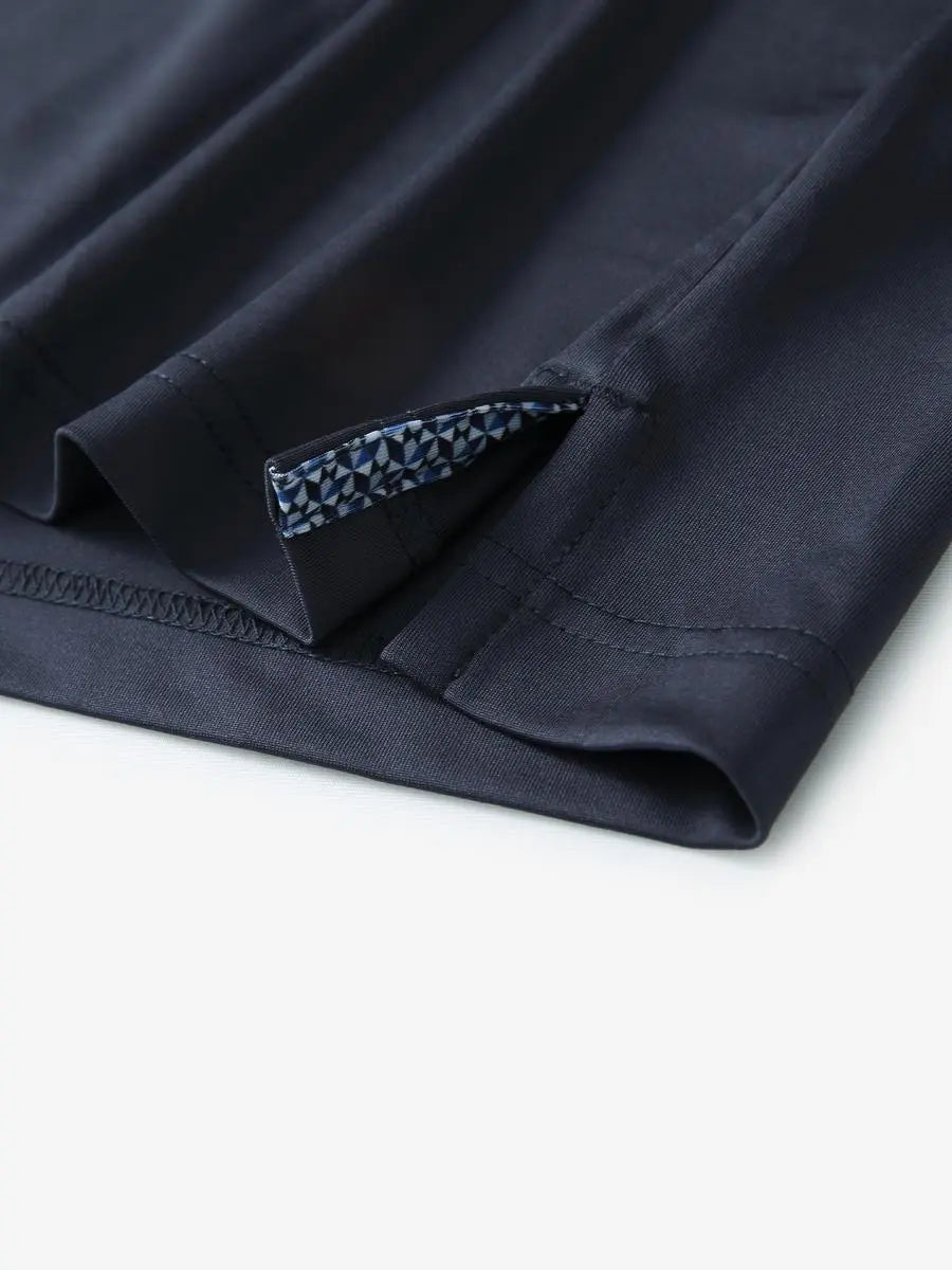 Close-up of side slit detail on the Dark Grey Everyday Classic Solid Polo hem