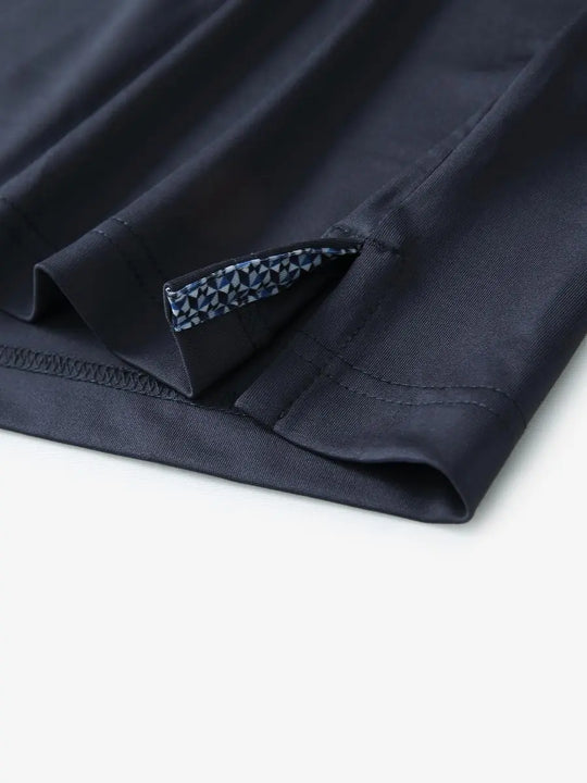 Close-up of side slit detail on the Dark Grey Everyday Classic Solid Polo hem