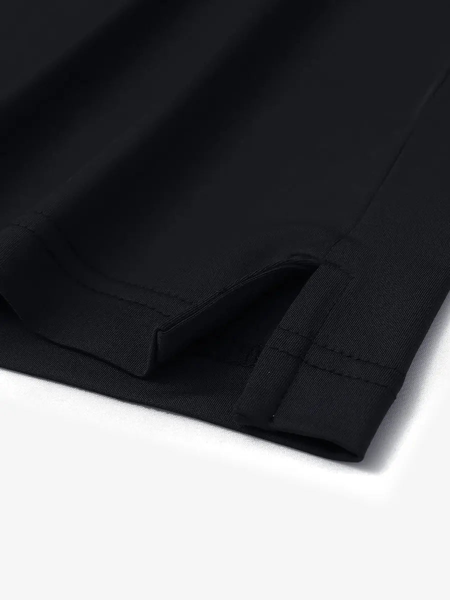 Close-up of hem slit on Everyday Solid Jersey Polo in BLACK, showcasing precise stitching and finish.