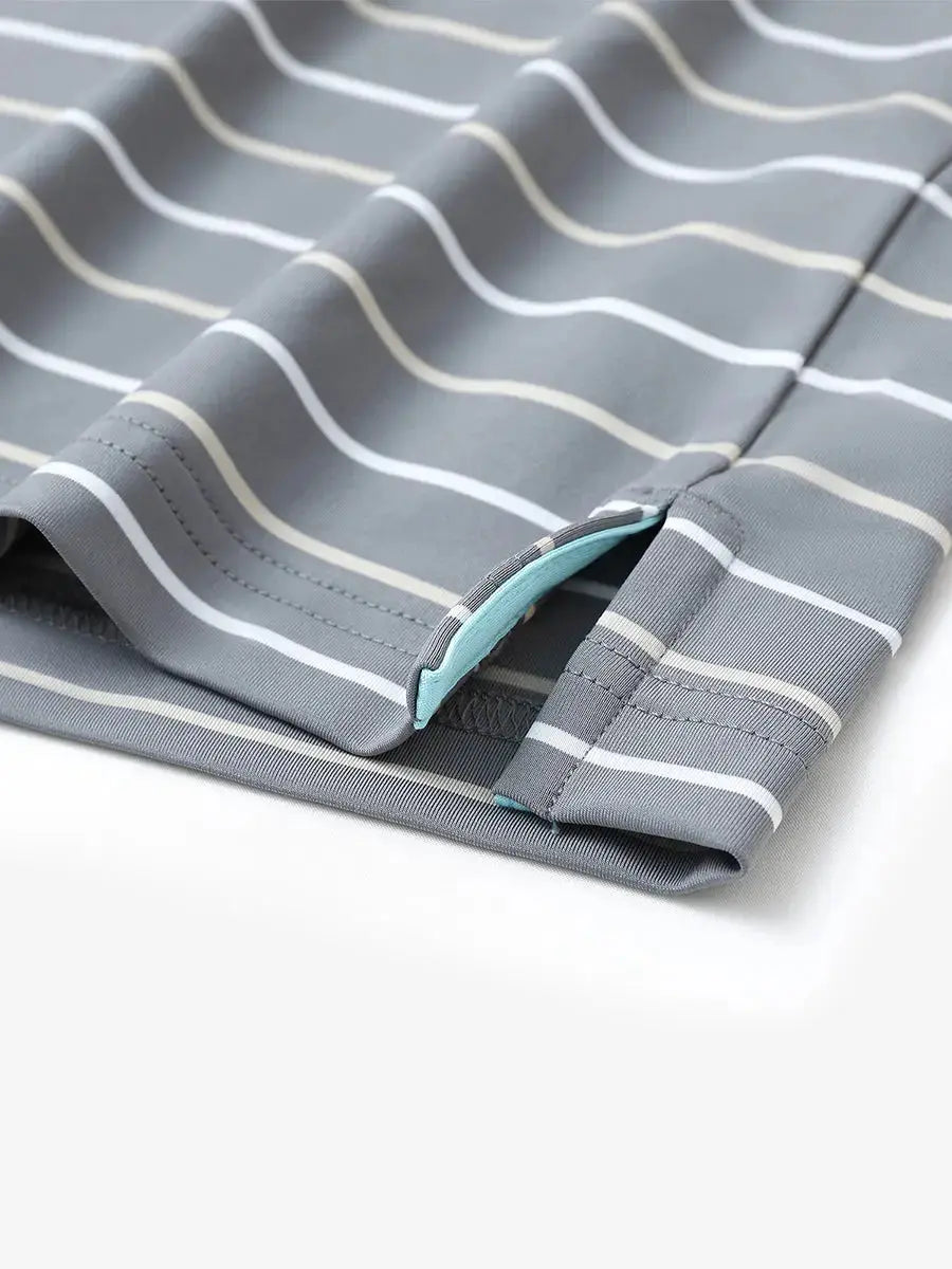 Hem slit detail of NEUTRAL STRIPE Kids Stylish Stripe Polo Shirt, highlighting finish and stitching.