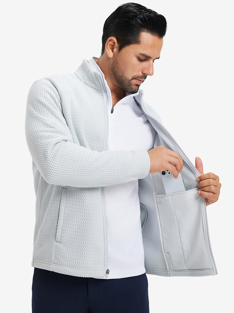 Model showing inner pocket of soft winter fleece jackets in light grey, fitting an iPhone inside.