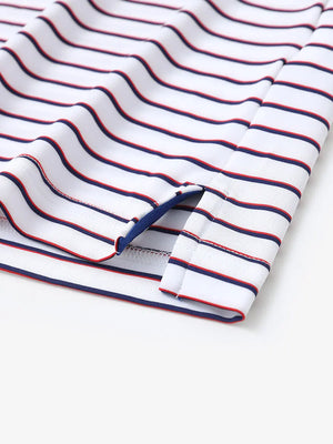 Close-up of side slit hem on WHITE/NAVY STRIPE Polo — neat and functional finish