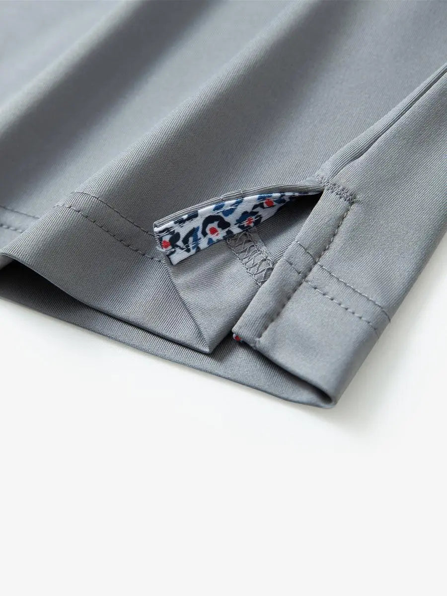 Close-up of side slit detail on the Light Grey Everyday Classic Solid Polo hem