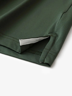 Hem slit detail of OLIVE GREEN Moisture Wicking Color Block Polo Shirt highlighting stitching and finish.