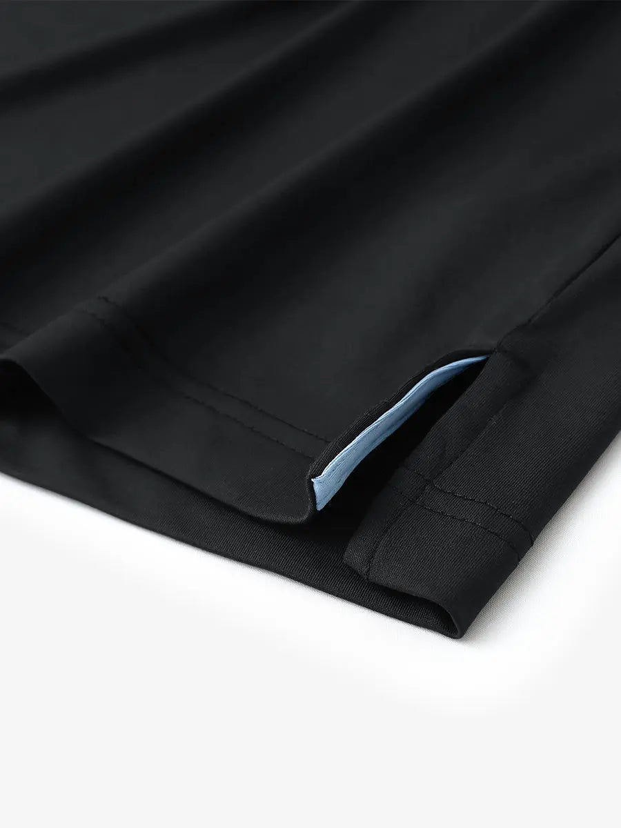 Hem slit detail of BLACK Stylish Chest Print Snap Polo highlighting stitching and finish