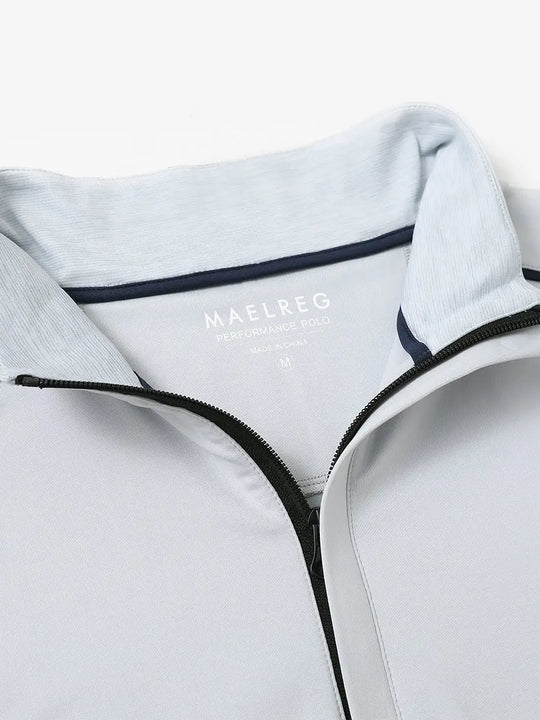 Close-up of collar and interior logo detail on GREY MIST Stretch Solid Fleece Quarter-Zip Vest.								
